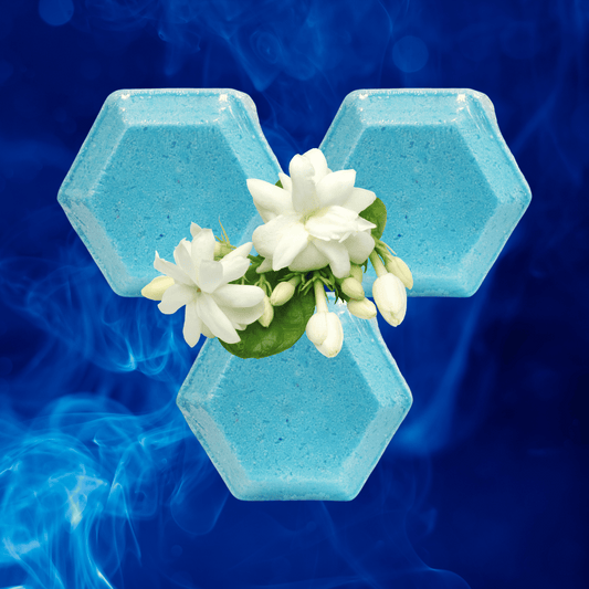 Hexagonal blue shower steamer with white flowers on a blue background