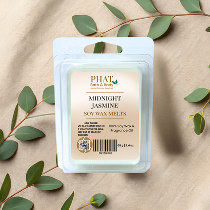 PHAT Bath & Body Midnight Jasmine soy wax melts packaging with green leaves on a beige fabric background