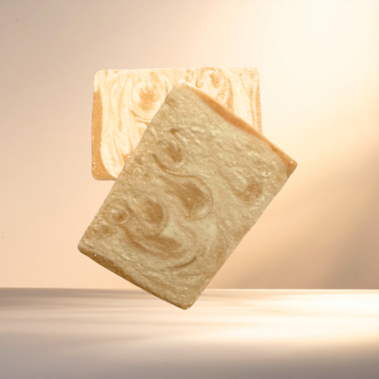 Two bars of soap with a marbled pattern on a neutral background