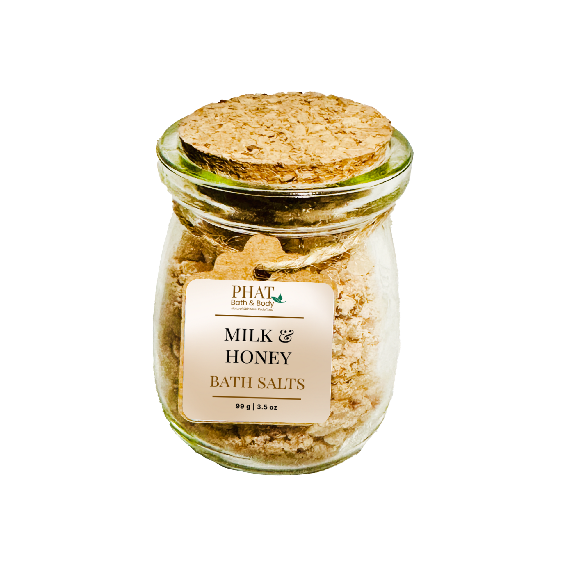 Glass jar of milk and honey bath salts with a cork lid on a white background