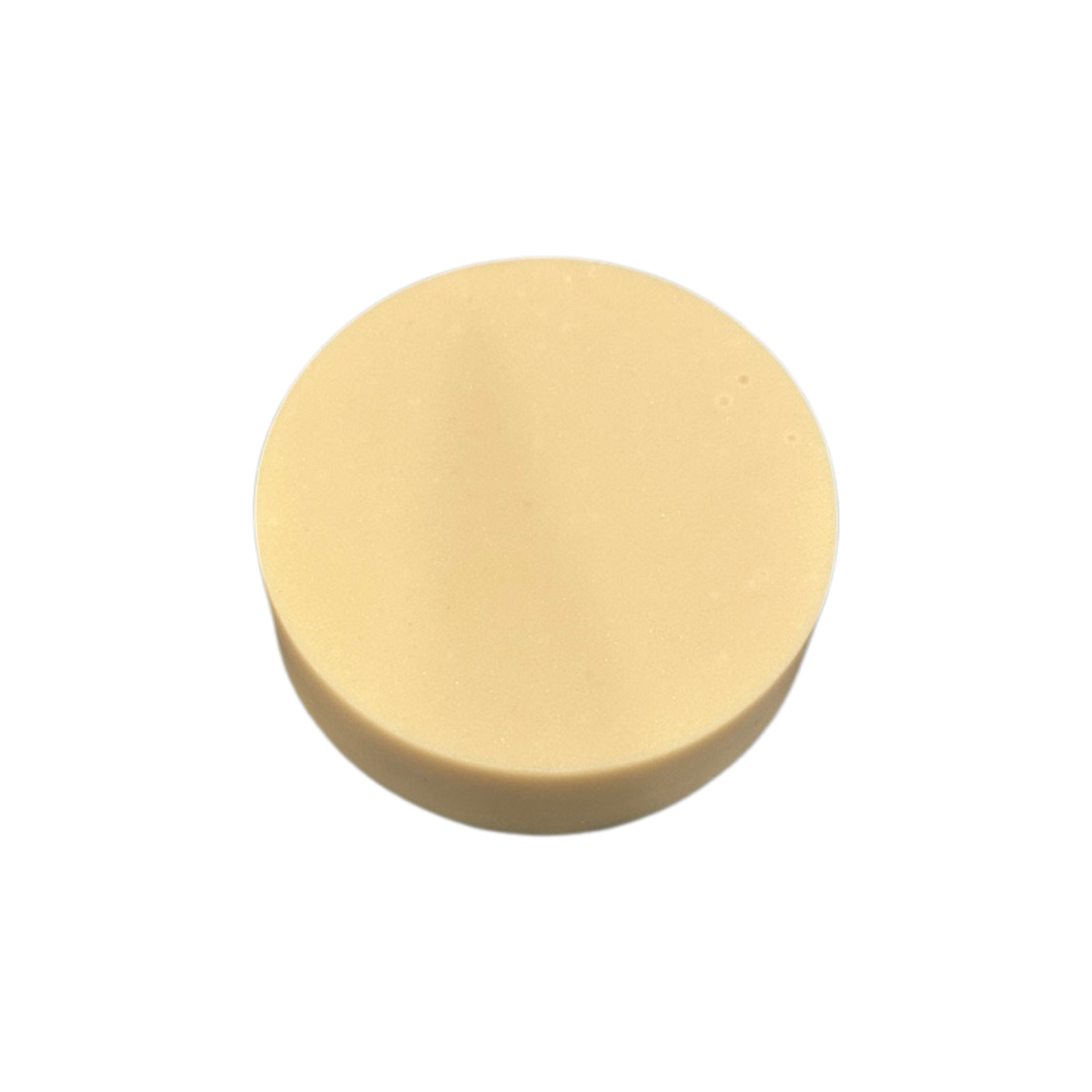 Round beige soap on a white background