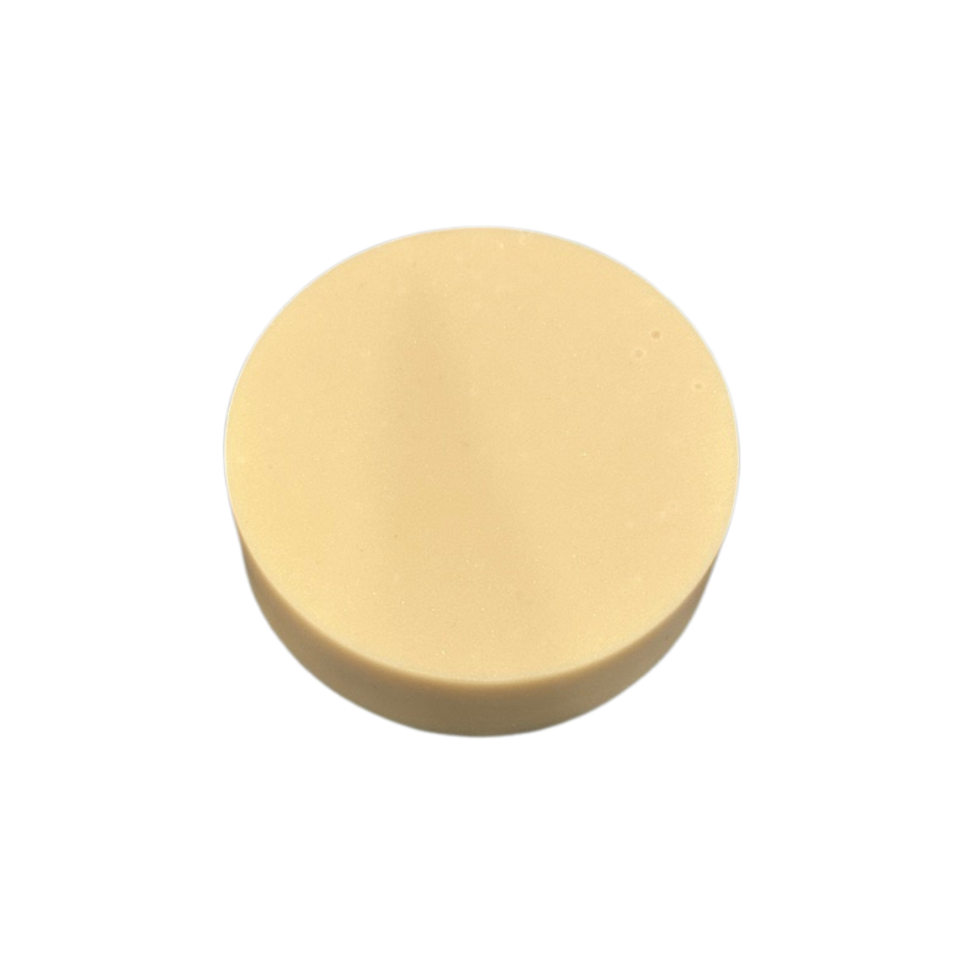 Round beige soap on a white background