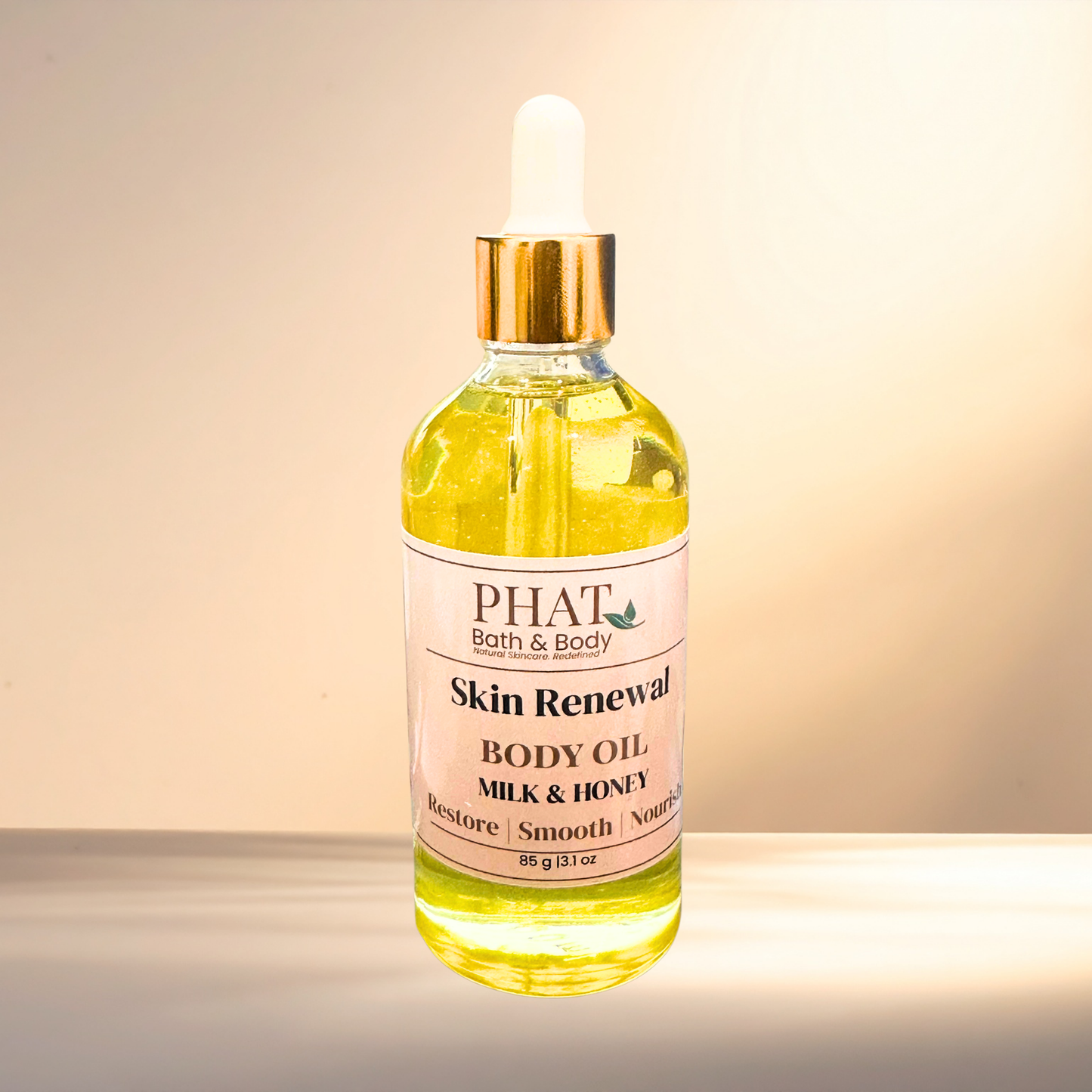 Bottle of PHAT Bath & Body Skin Renewal Body Oil with a dropper on a gradient background