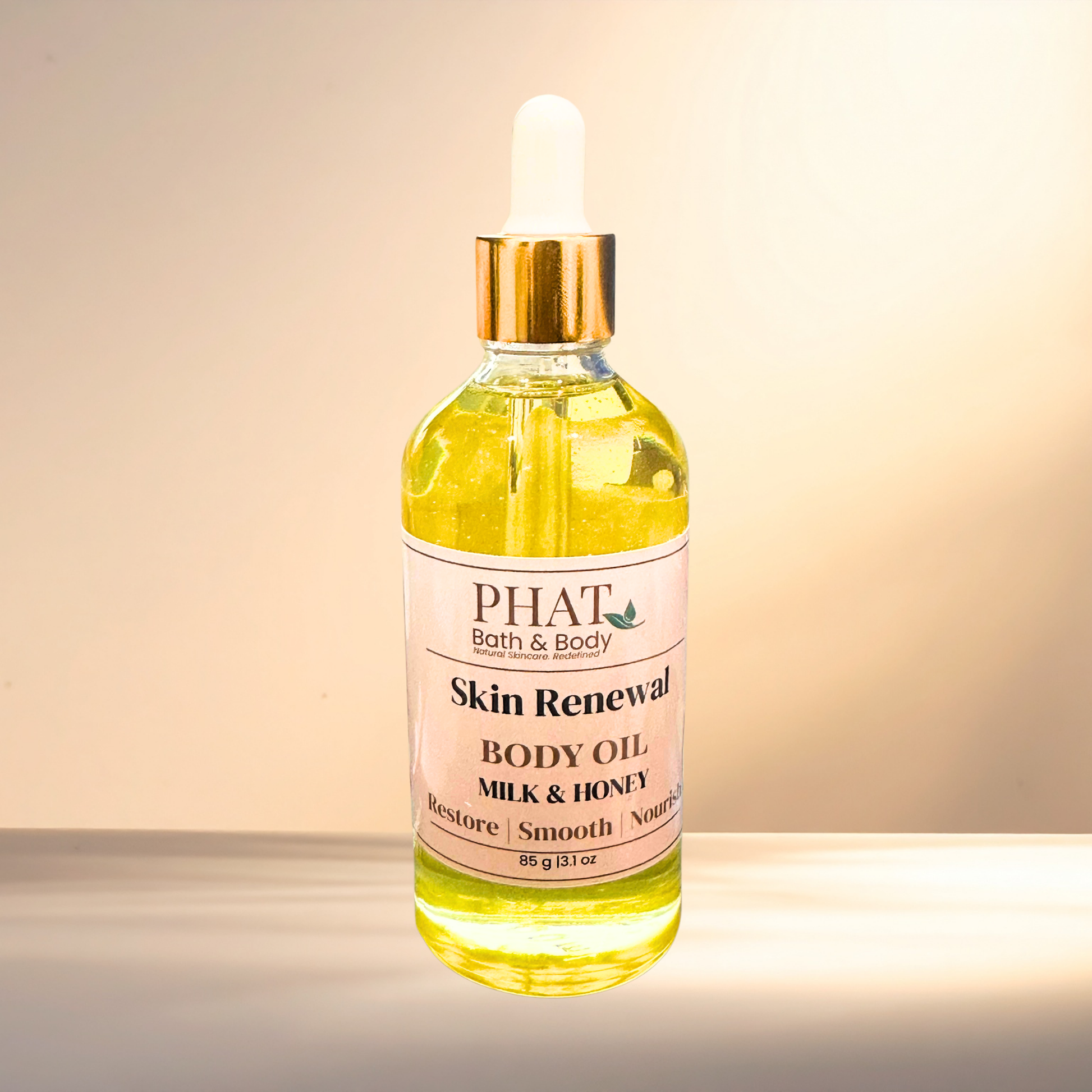 Bottle of PHAT Bath & Body Skin Renewal Body Oil with a dropper on a gradient background