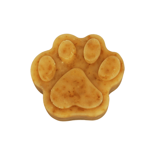 Dog paw-shaped soap on a white background
