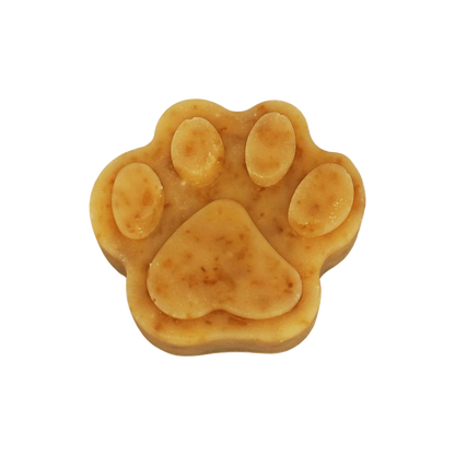 Dog paw-shaped soap on a white background