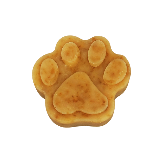 Dog paw-shaped soap on a white background