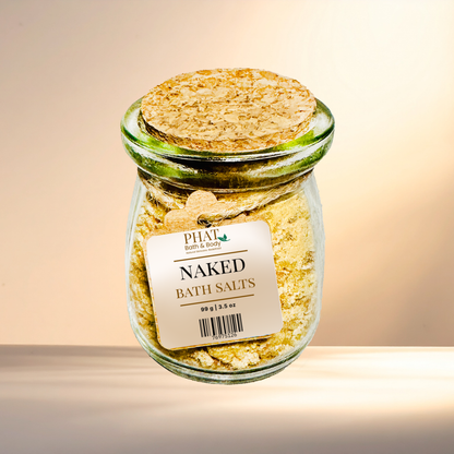 Jar of 'Naked Bath Salts' with a cork lid on a gradient background