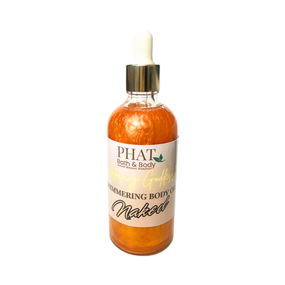 Bottle of 'Naked' shimmering body oil by Phat Bath & Body on a white background