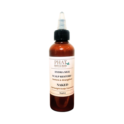An amber bottle of PHAT Bath & Body Hydra silk Scalp Restore treatment with a black twist cap and a cream-colored label, shown on a plain white background.