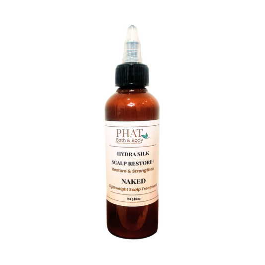An amber bottle of PHAT Bath & Body Hydra silk Scalp Restore treatment with a black twist cap and a cream-colored label, shown on a plain white background.