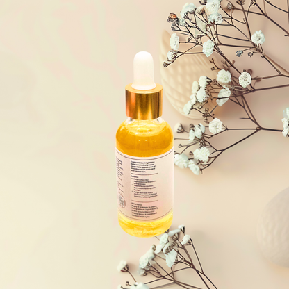 Yellow dropper bottle with a beige background and white flowers