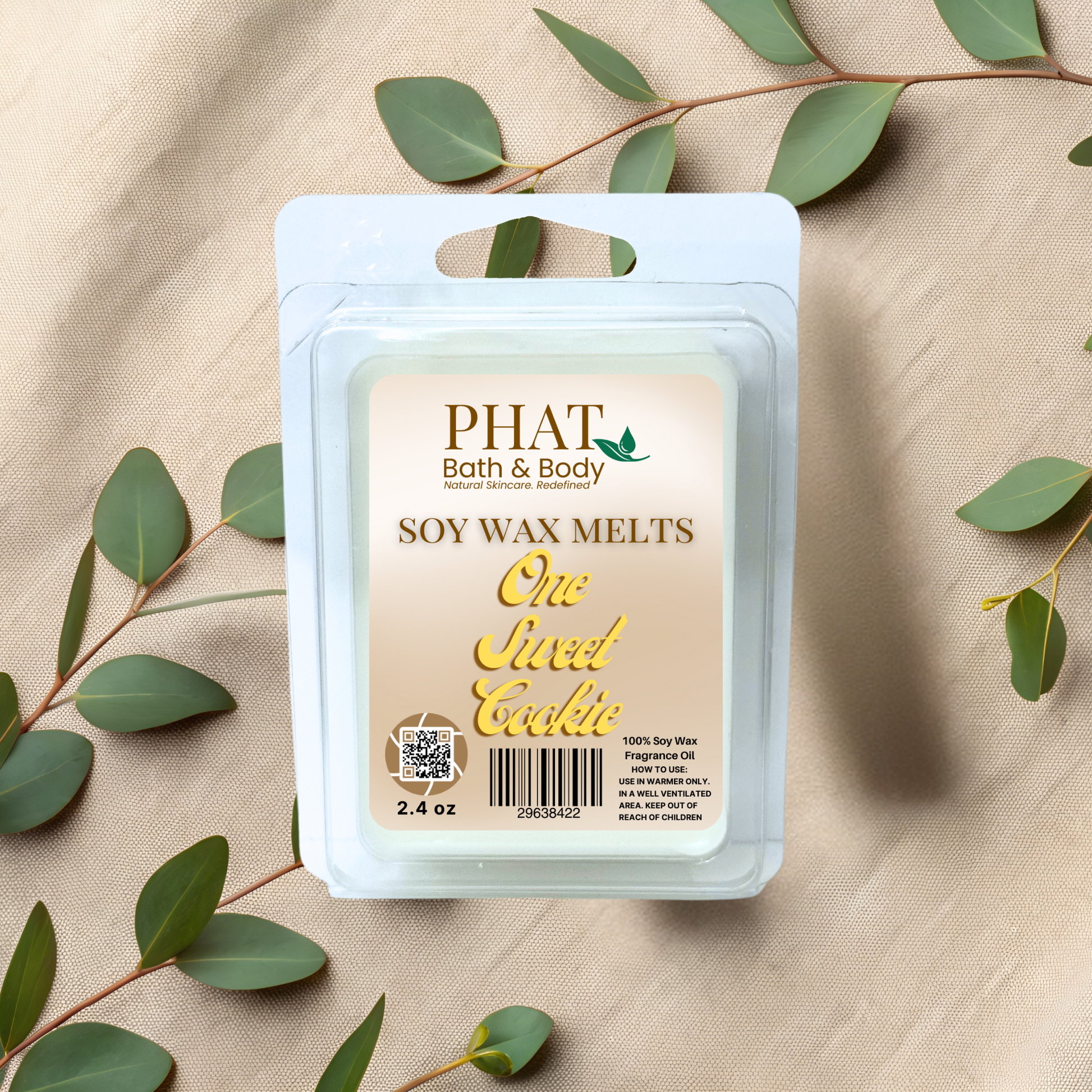 Phat Bath & Body soy wax melt packaging with green leaves on a beige fabric background