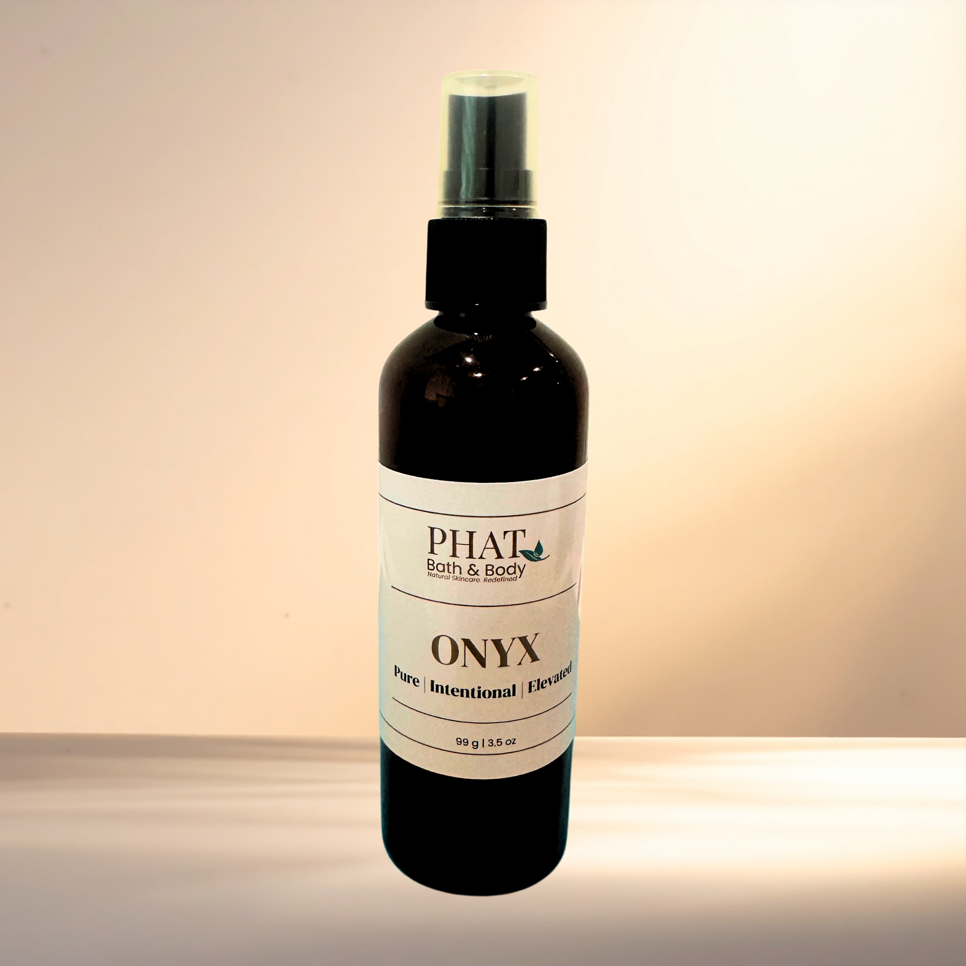Bottle of 'Onyx' by Phat Bath & Body on a gradient background
