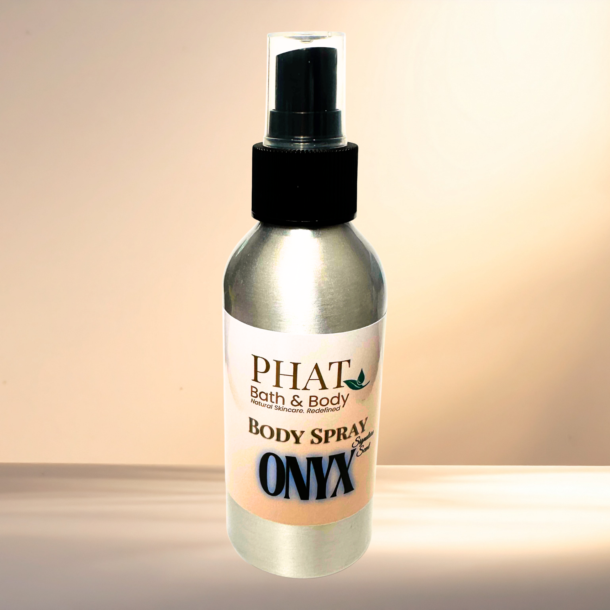 Body spray bottle labeled 'PHAT Bath & Body' with 'ONYX' on a gradient background