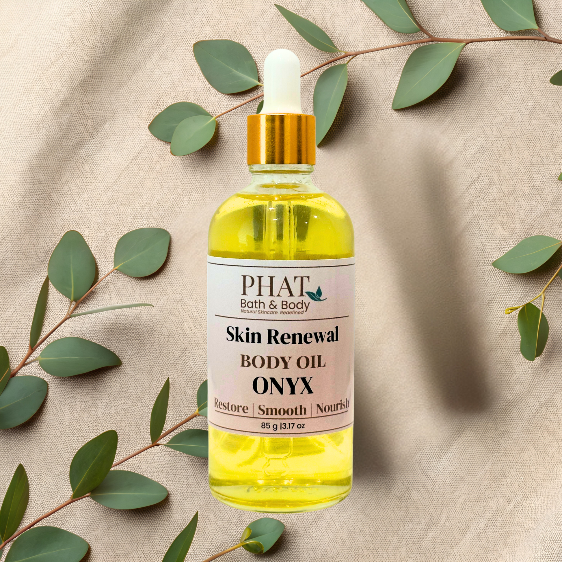 Bottle of 'Onyx' by Phat Bath & Body on a beige fabric background with green leaves.