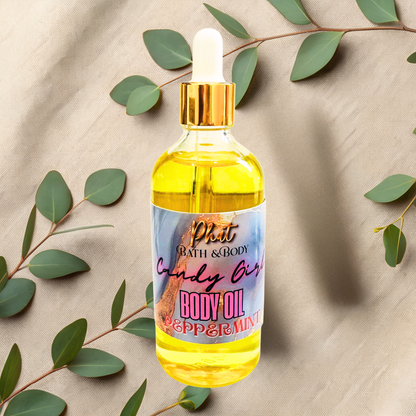 Bottle of body oil with a dropper on a beige fabric background with green leaves.