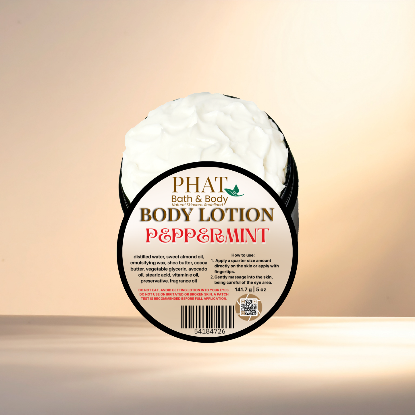 Body lotion container labeled 'Peppermint' by 'Phat Bath & Body' on a beige background