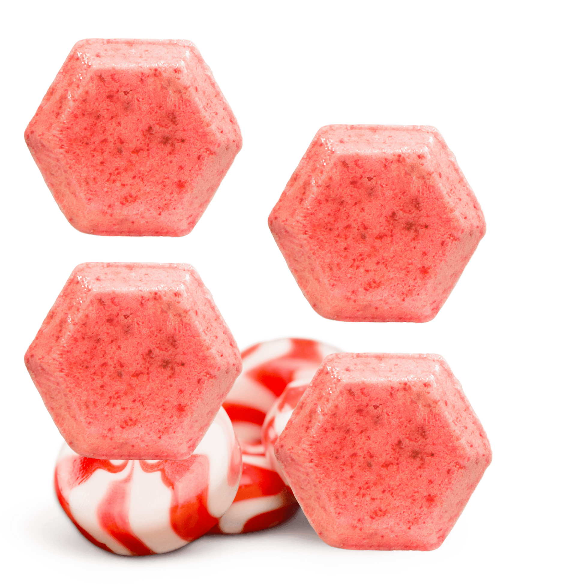 Hexagonal pink shower steamers with peppermint candy on a white background