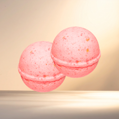 Two pink bath bombs on a beige background