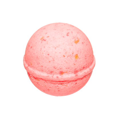 Pink bath bomb with speckles on a white background