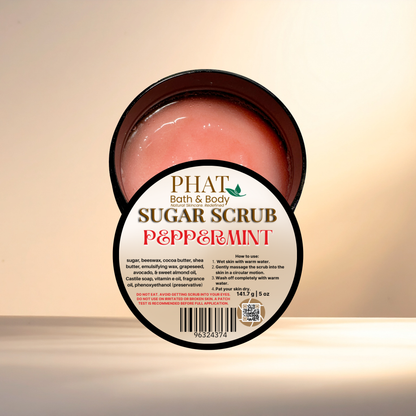 Jar of sugar scrub with 'PHAT Bath & Body' branding on a beige background