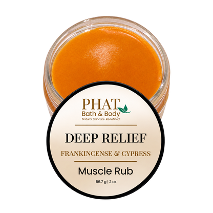 Phat Bath & Body Deep Relief Muscle Rub in Frankincense & Cypress, featuring an open 2 oz jar of smooth orange botanical massage balm with its cream-colored branded lid. Formulated for massaging tired areas.
