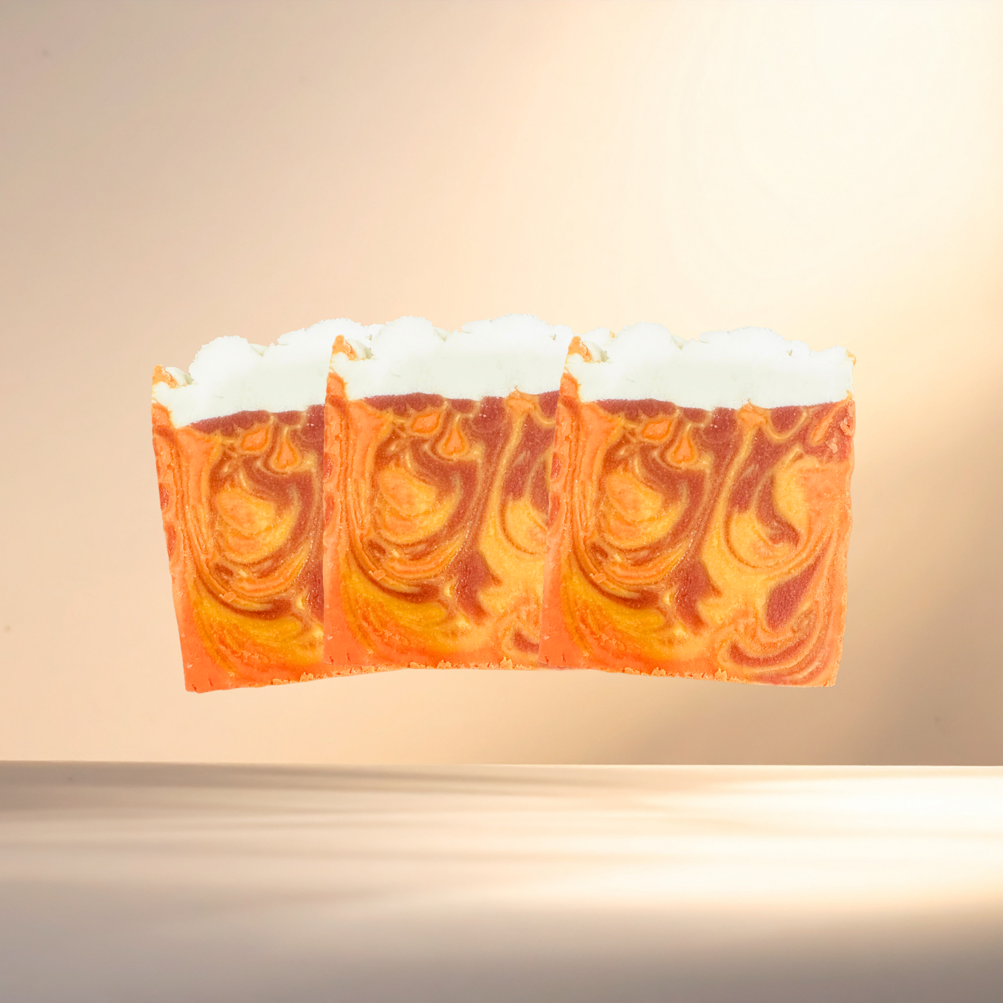 Bar of soap with orange and white swirl pattern on a beige background