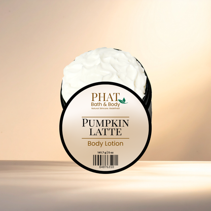Body lotion container labeled 'Pumpkin Latte' by PHAT Bath & Body on a beige background