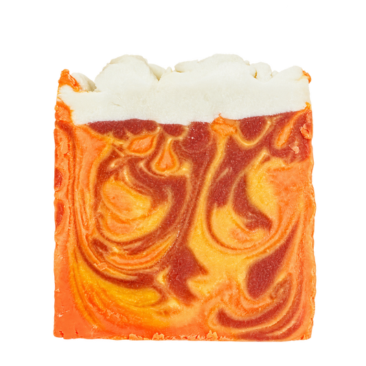 Phat Bath & Body Pumpkin Latte handmade bar soap with orange, golden yellow, and cinnamon-brown swirls topped with a textured white soap layer on a transparent background.