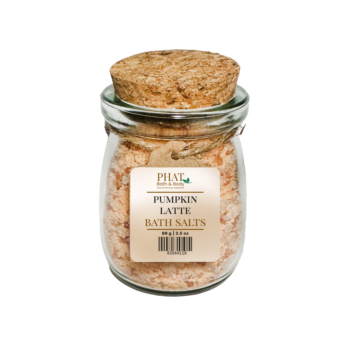 Jar of pumpkin latte bath salts with a cork lid on a white background