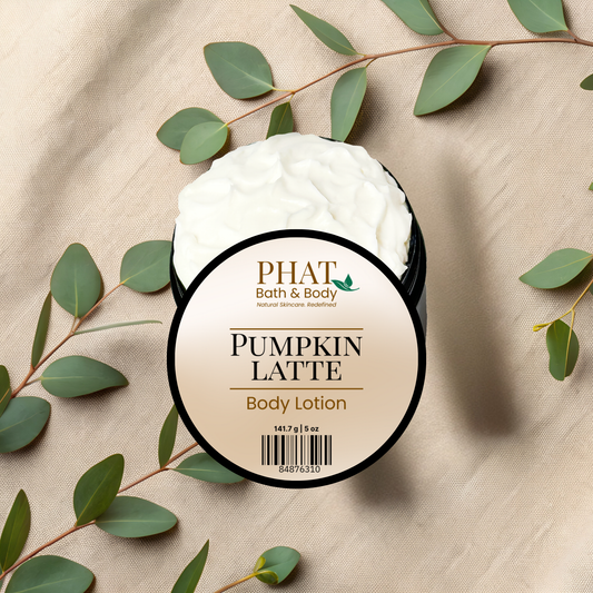 Pumpkin Latte body lotion jar with green leaves on a beige fabric background