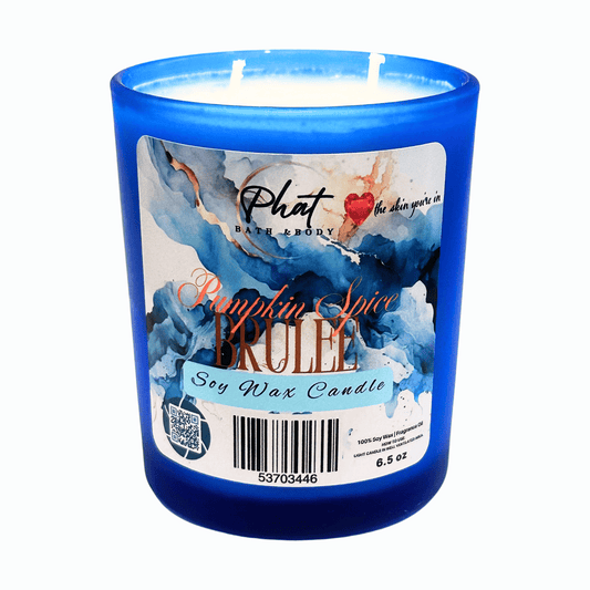 Blue candle with a decorative label on a white background