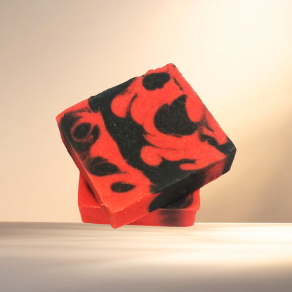 Red and black patterned soap bar on a neutral background