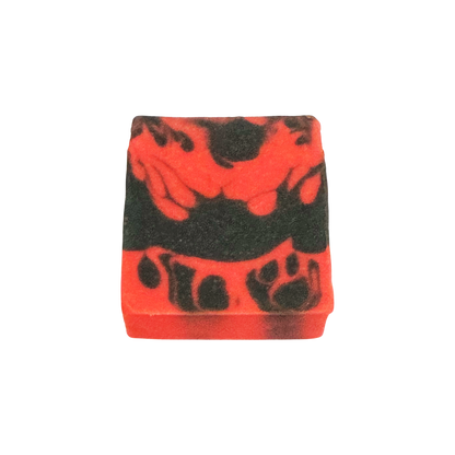 Red and black patterned bar of soap on a white background