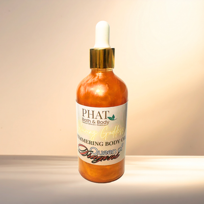 Bottle of 'Queen of Dragons' body oil from PHAT Bath & Body on a gradient background