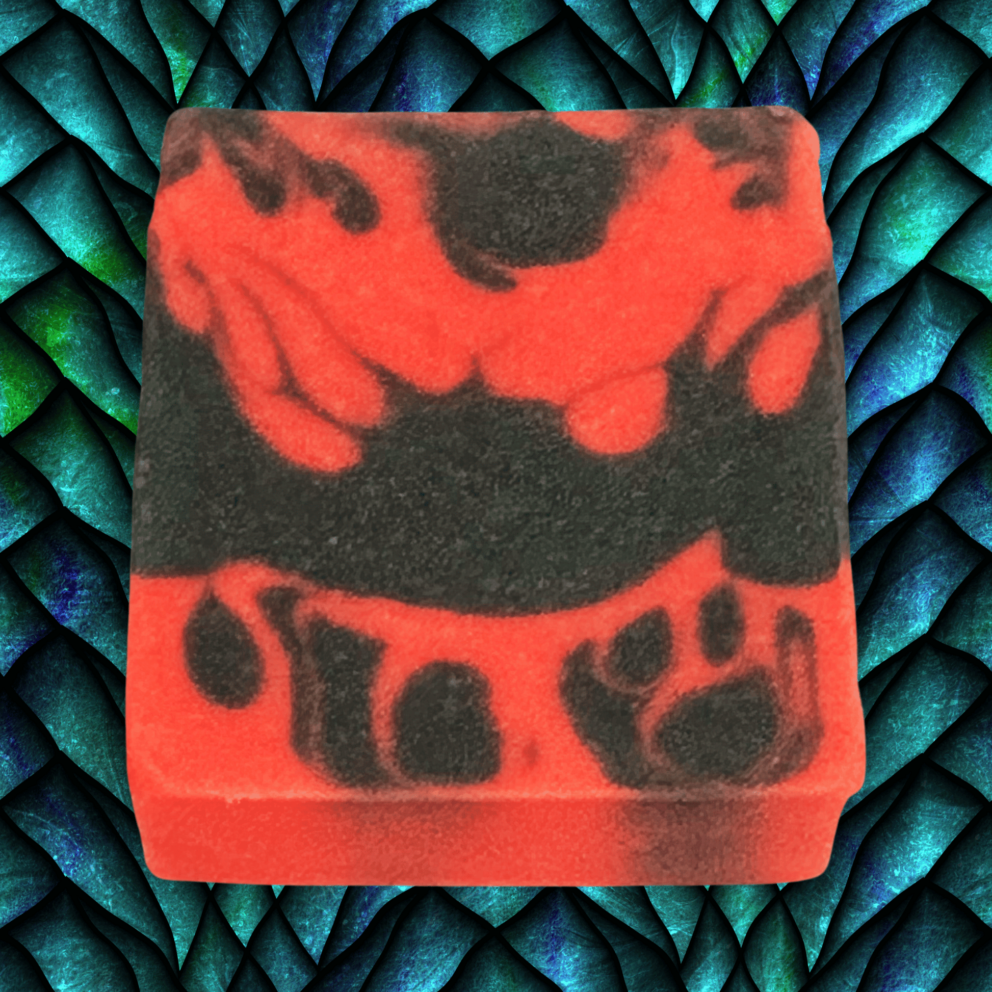 Red and black soap bar on a textured blue and green background