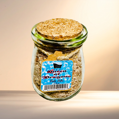 Jar of 'Queen of Dragons' bath salts with a cork lid on a gradient background