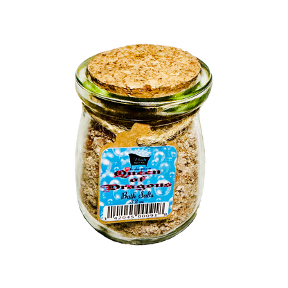 Jar of 'Queen of Dragons' bath salts with a cork lid on a white background