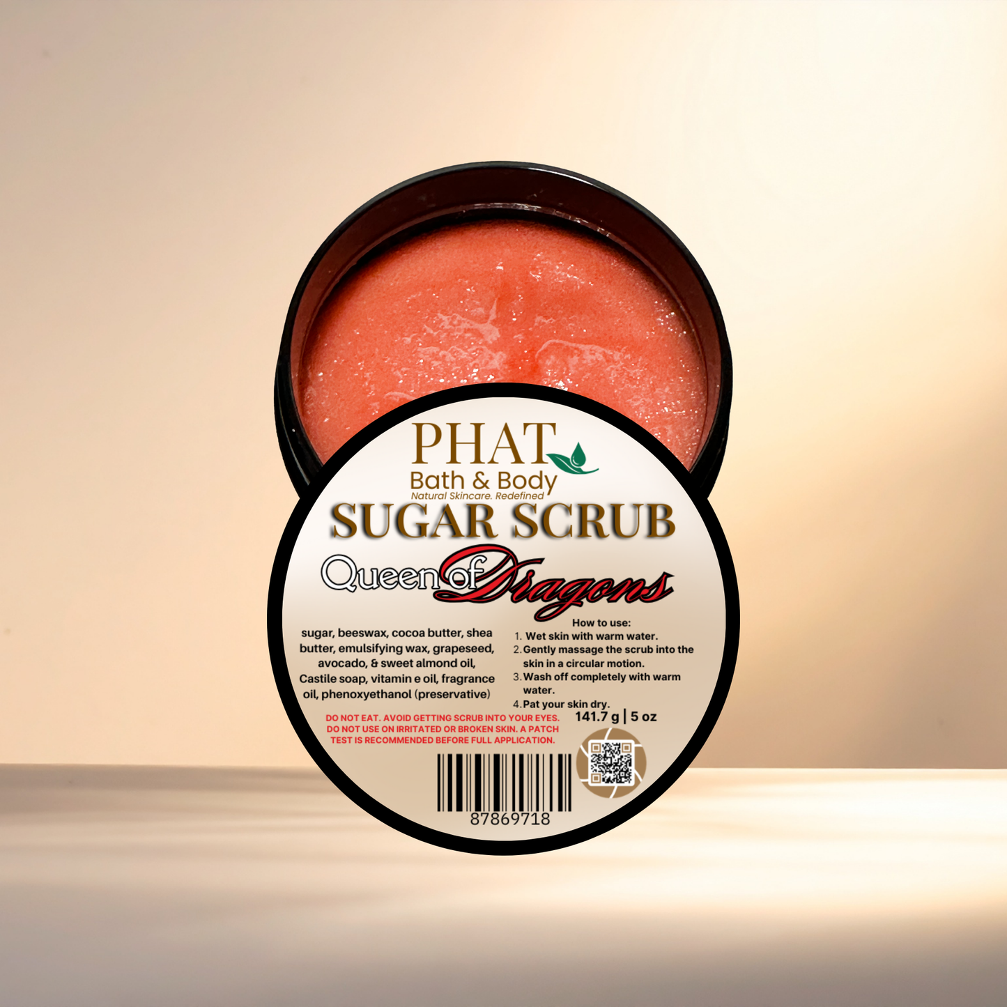 Jar of sugar scrub with visible label on a beige background