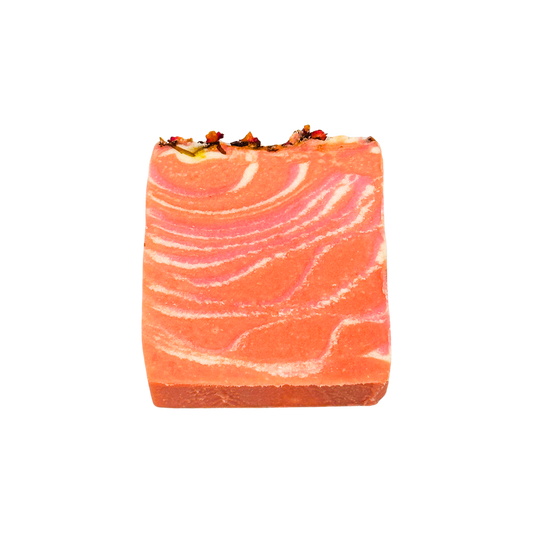 Marbled pink and orange soap bar on a white background
