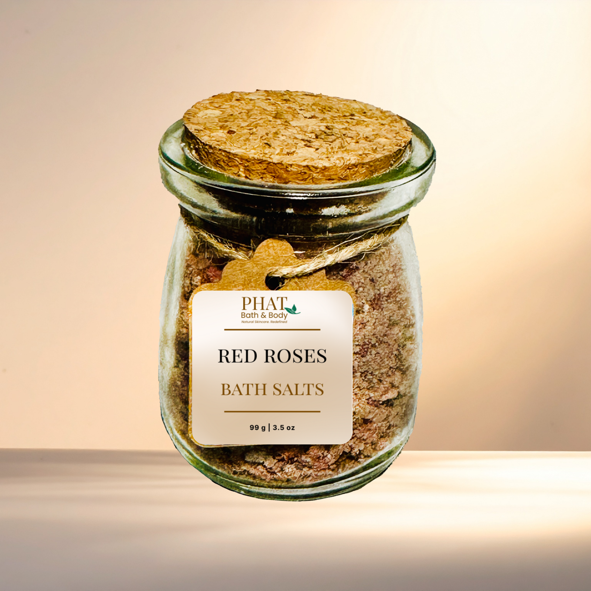 Jar of 'Red Roses Bath Salts' with a cork lid on a gradient background