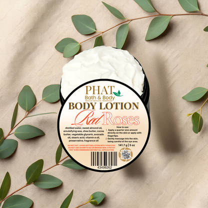 Body lotion container labeled 'Red Roses' from Phat Bath & Body on a beige fabric background with green leaves.