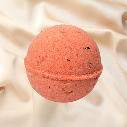 Red bath bomb on a beige fabric background