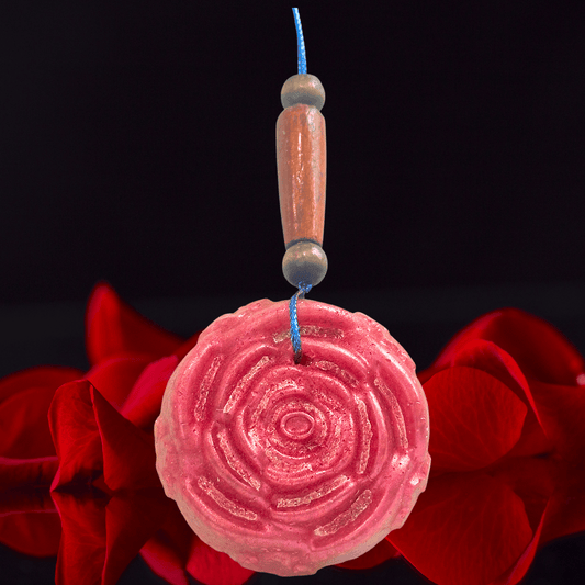 red rose shaped car freshie with roses on a black background