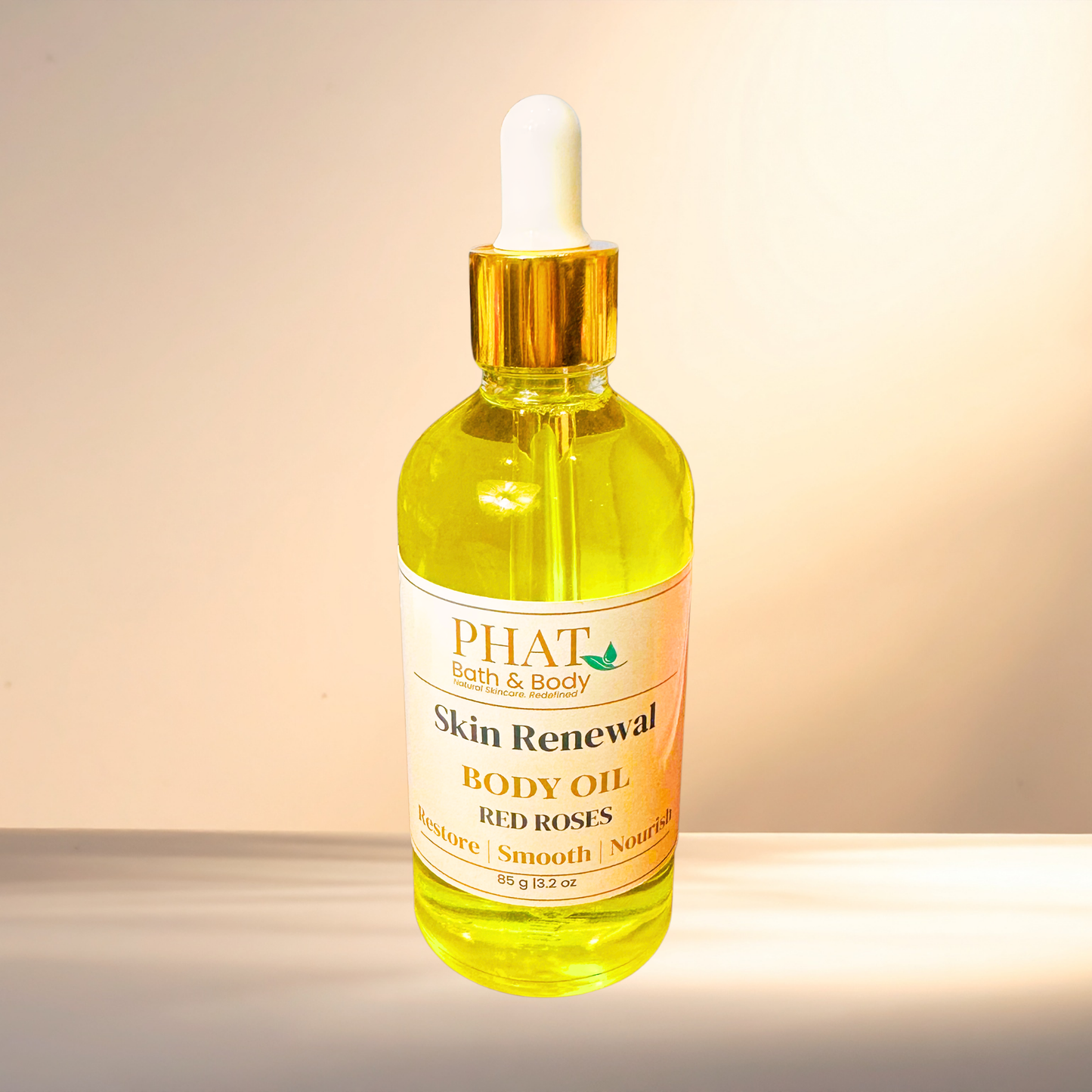 Bottle of PHAT Skin Renewal Body Oil with a dropper on a gradient background