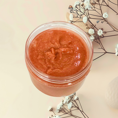 Jar of red scrub with flowers on a beige background