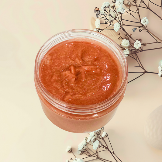 Jar of red scrub with flowers on a beige background