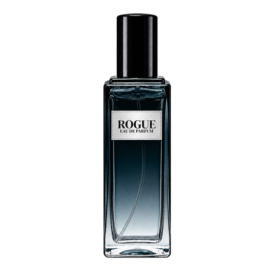 Phat Bath & Body Rogue Men’s Eau de Parfum in a tall clear glass perfume bottle with black cap, warm tan label, and deep blue-gray fragrance, shown as the main product image.