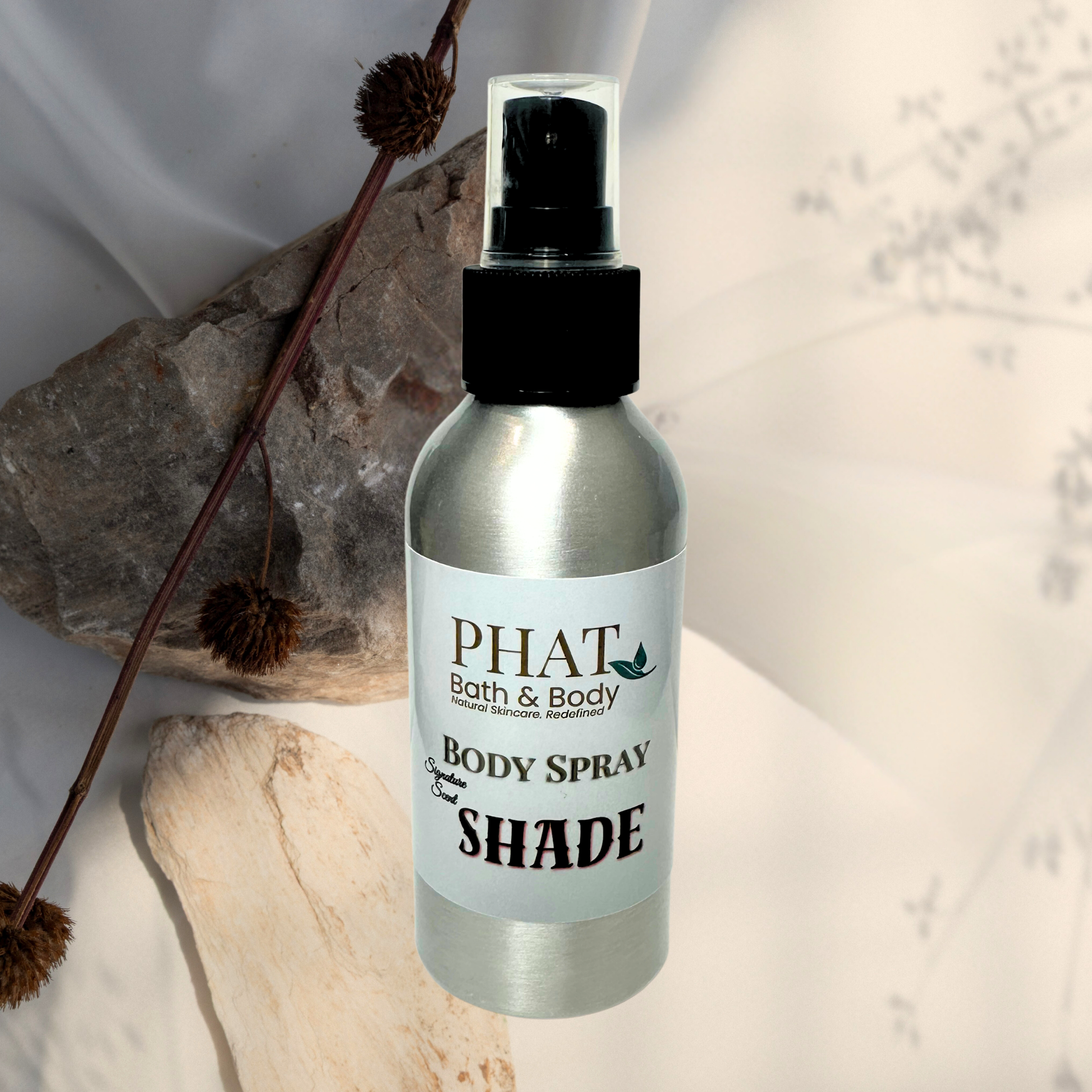 Body spray bottle labeled 'PHAT Bath & Body' on a neutral background